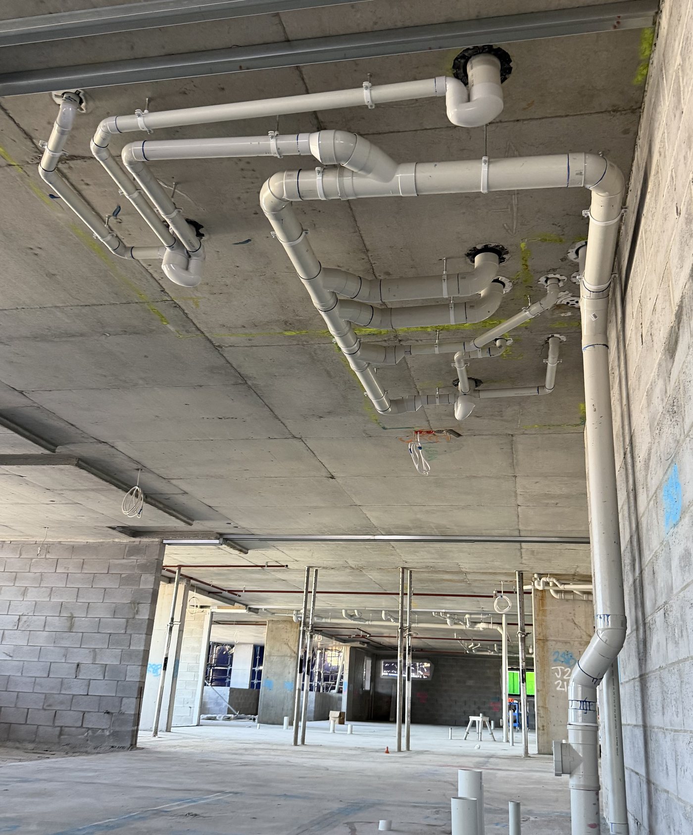 Multi-level stack pipework in a commercial building